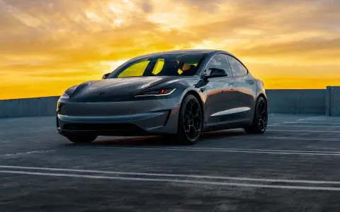 Sunset photo of a Quicksilver Tesla Model 3 Performance parked with UP-05 Forged Wheels.