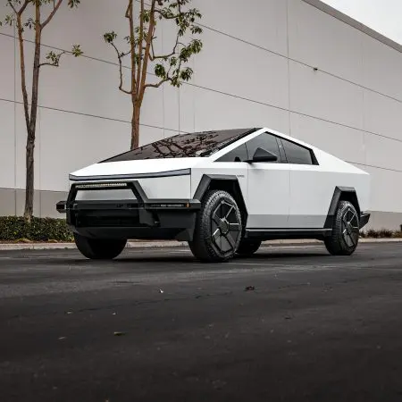 White Tesla Cybertruck with UP INVINCIBLE Steel Front Bull Bar and Rock Sliders