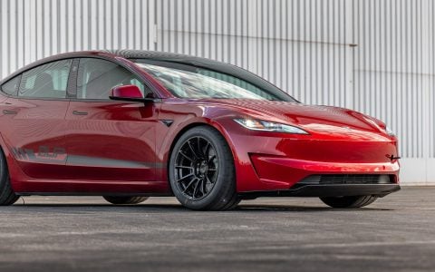 Tesla Model 3 Performance in Ultra Red, equipped with lightweight UP-03 Forged Wheels in Gloss Black by Unplugged Performance, designed for improved handling.