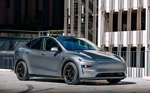 A front three quarter shot of a 2026 Tesla Model Y Launch Edition with Satin Black 19 inch UP-05 Forged Wheels and Yokohama tires.