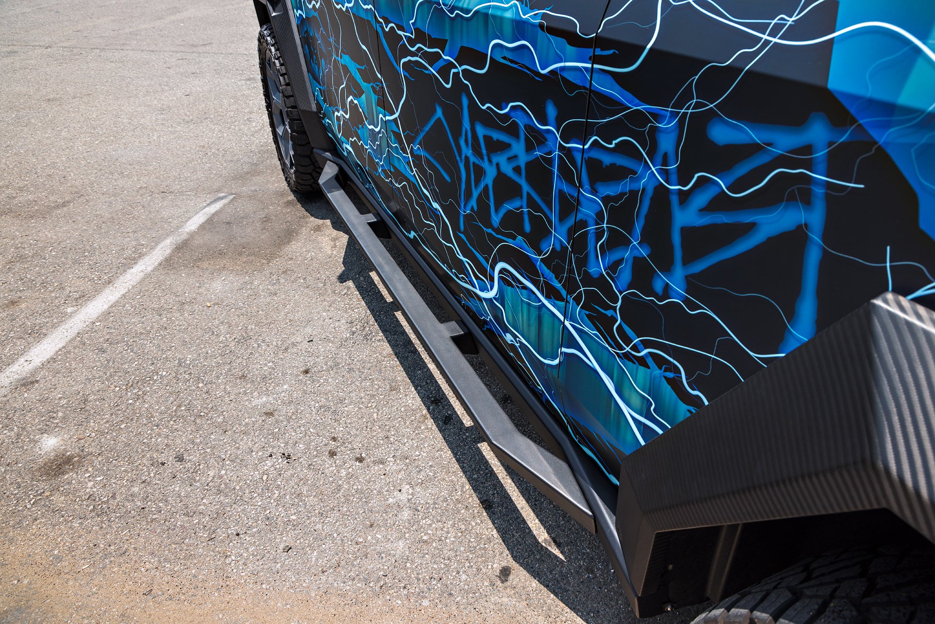 Thunderstruck Invincible Cybertruck 4 Lightning Graphic Wrapped Invincible Cybertruck on UP Forged 24" CYBRHEX Wheels in Satin Titanium