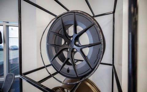 Welcoming Hundreds of Tesla Enthusiasts to Experience the Future of Tesla Customization 19 Unplugged Performance wheels display showcase for guests to view and learn more about.