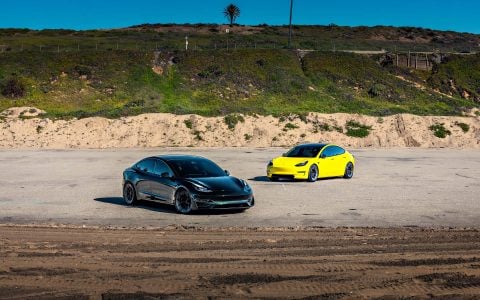 Dark Emerald Metallic Tesla Model 3 Performance Side By Side with Yellow Wrapped Tesla Model 3Dark Emerald Metallic Tesla Model 3 Performance Side By Side with Yellow Wrapped Tesla Model 3