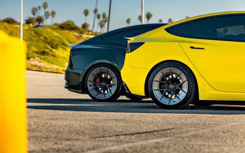 Dark Emerald Metallic Tesla Model 3 Performance Side By Side with Yellow Wrapped Tesla Model 3