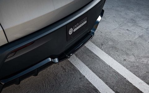 Quicksilver Tesla Model Y Performance With UP Aero Kit Side By Side with OEM Diamond Black Model Y Performance