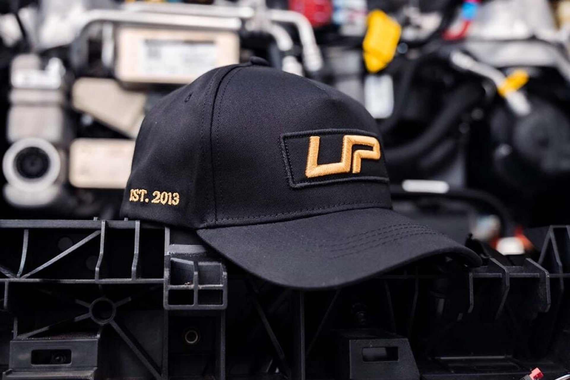 The Father's Day Gift Guide for Every Tesla Dad 3 Unplugged-Performance-UP-Snapback-Gold-Edition