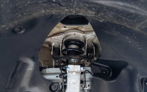 Tesla Model Y Juniper with Leveling Lift Kit and Rear Camber Arms Unplugged Performance 1