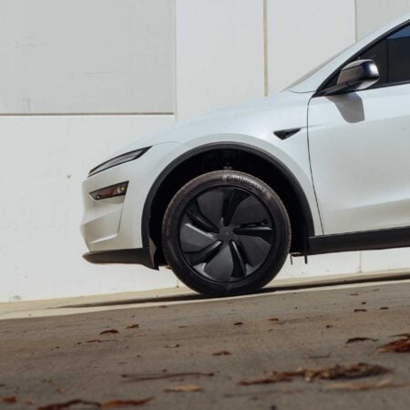 Pearl White Tesla Model Y Juniper on Leveling Lift Kit